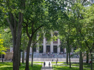 Students walking in Harvard Yard