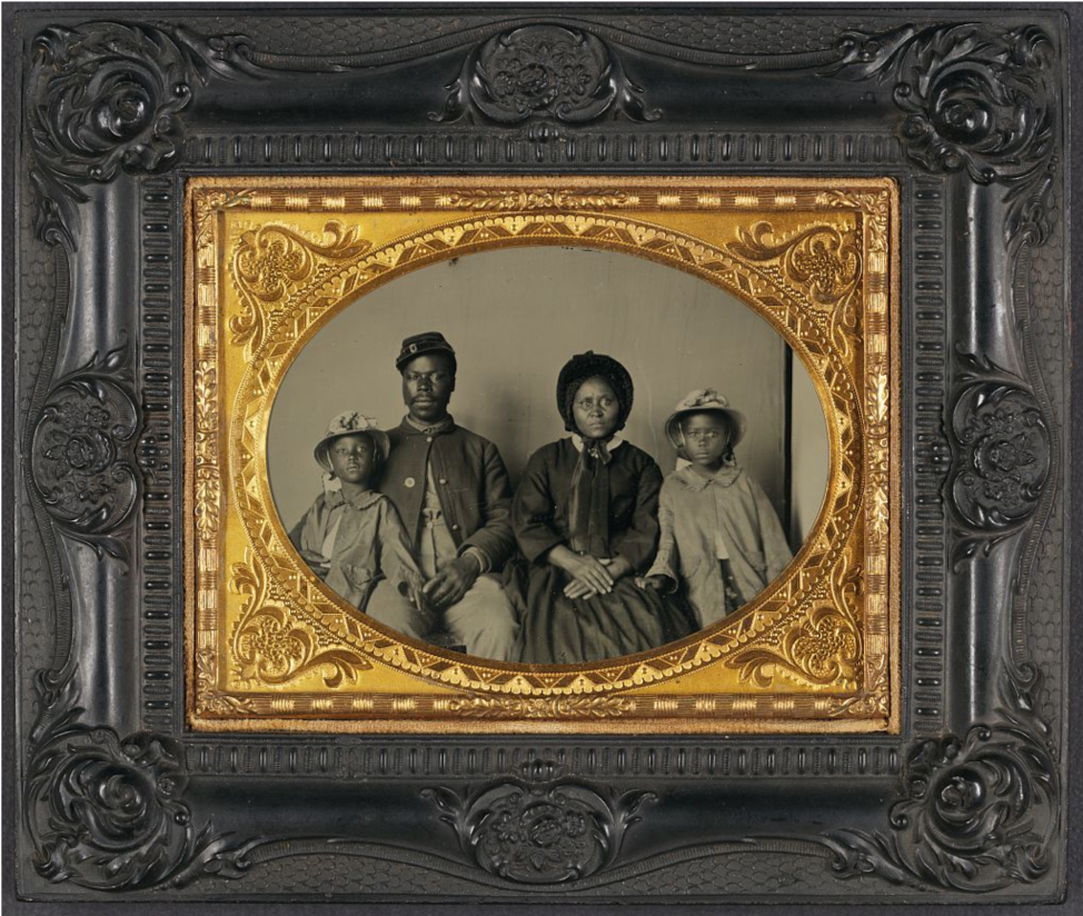 Unidentified African American soldier in Union uniform with wife and two daughters.