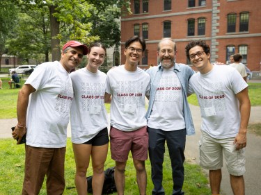 Alan Garber, Rakesh Khurana, and students on move-in day