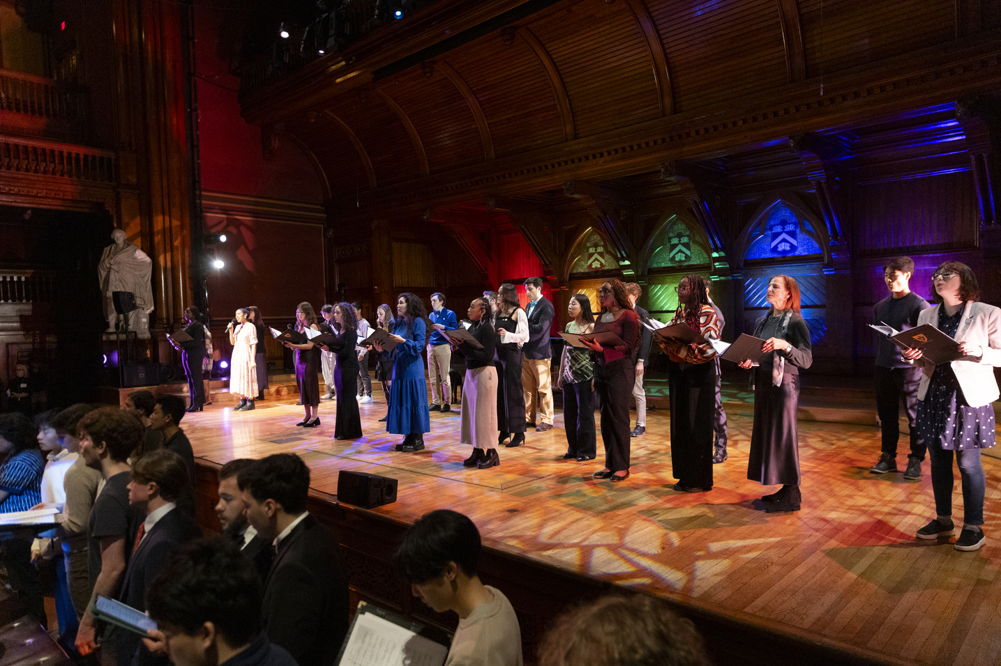 A chorus on stage performing.