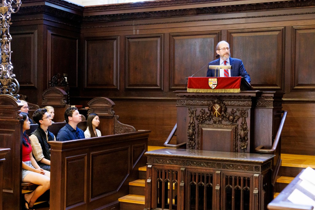 Alan Garber at a podium speaking.