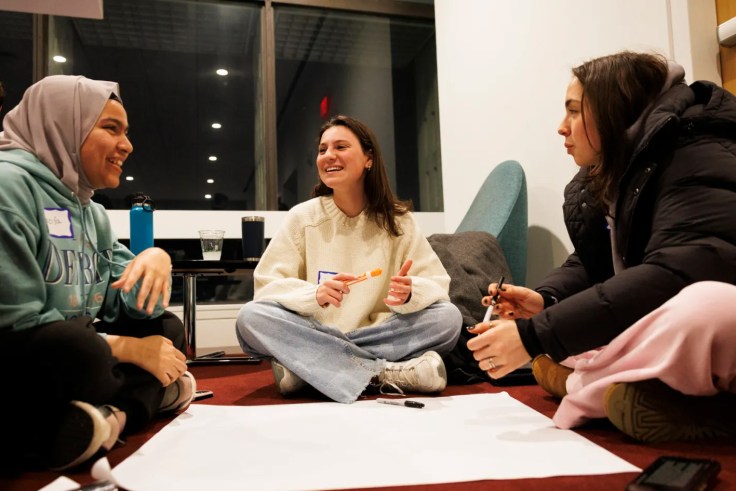 Three students talking