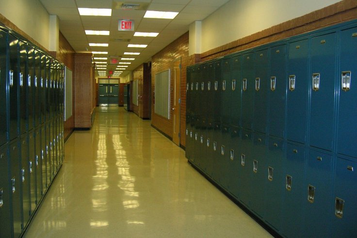 An empty school hallway with lockers