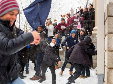 Student having a snowball fight