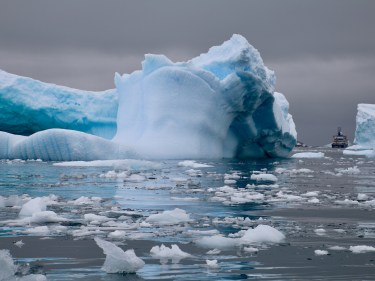 A glacier rests in the water in the Antarctic