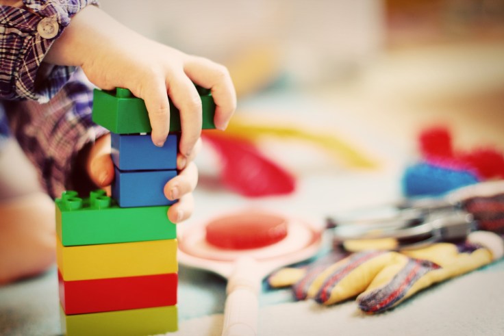 A child uses legos in a classroom