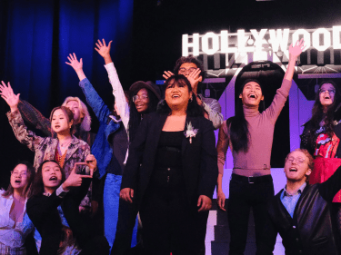 Students on stage putting on a play