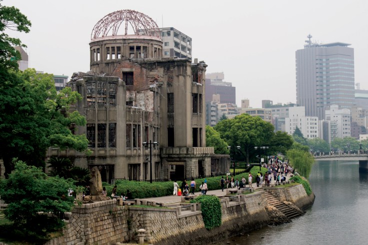 An old temple next to a modern city