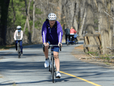 A person biking on a bike trail