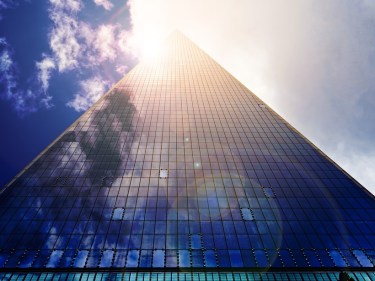 A building with a reflection of the sun