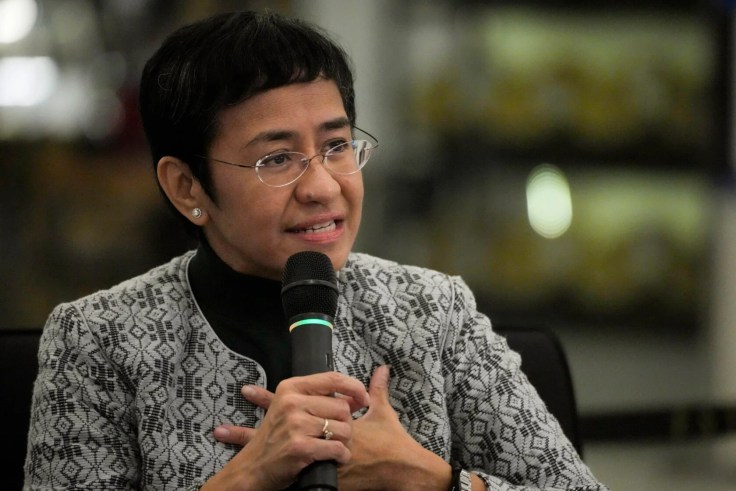 Maria Ressa talking into a microphone