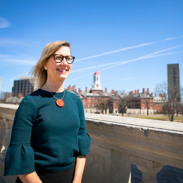 A woman stands outside in Cambridge