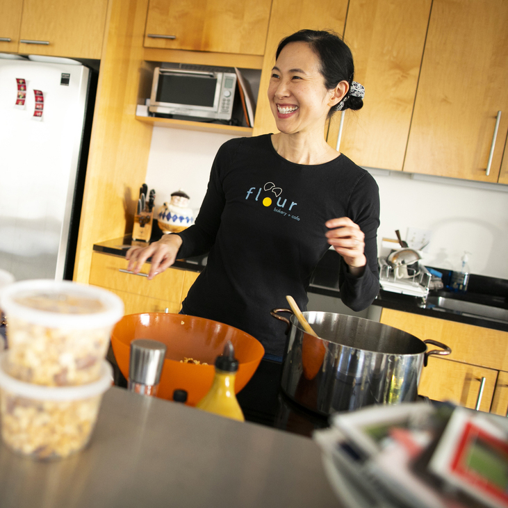 Joanne Chang wears an apron in a kitchen