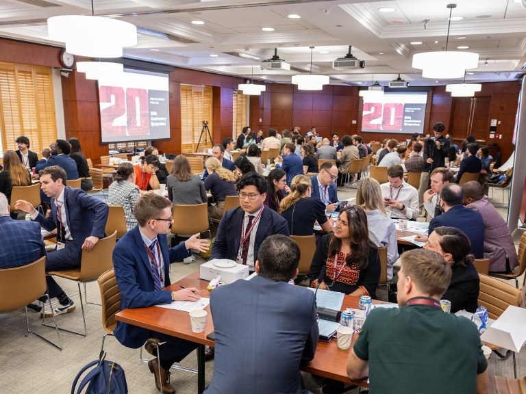 People at tables talking to each other