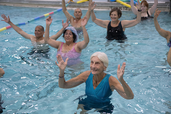 Older adults exercising in a pool