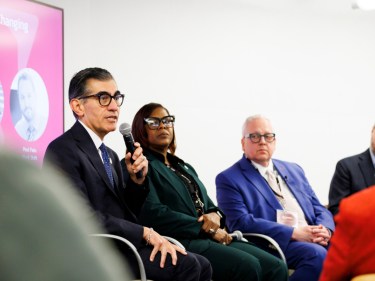 A panel of speakers at a conference